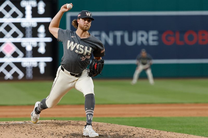 Jun 7, 2024; Washington, District of Columbia, USA; Washington Nationals starting pitcher Jake Irvin (27) pitches against the Atlanta Braves during the sixth inning at Nationals Park. Mandatory Credit: Geoff Burke-USA TODAY Sports