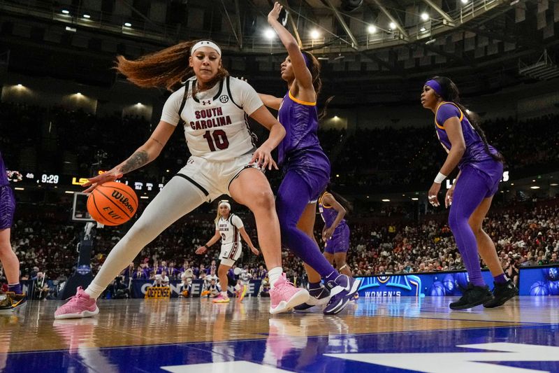 Mar 10, 2024; Greensville, SC, USA; South Carolina Gamecocks center Kamilla Cardoso (10) works the ball toward the basket against LSU Lady Tigers forward Angel Reese (10) during the second half at Bon Secours Wellness Arena. Mandatory Credit: Jim Dedmon-USA TODAY Sports