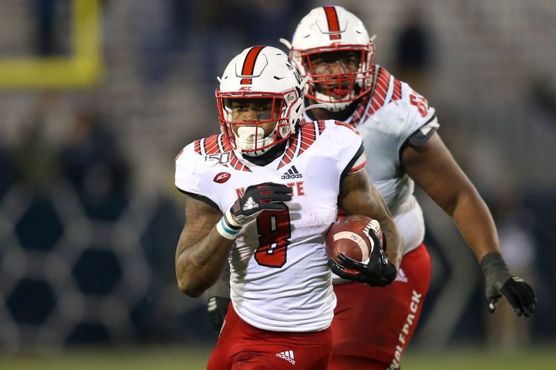 Nov 21, 2019; Atlanta, GA, USA; North Carolina State Wolfpack running back Ricky Person Jr. (8) runs the ball against the Georgia Tech Yellow Jackets in the second half at Bobby Dodd Stadium. Mandatory Credit: Brett Davis-USA TODAY Sports