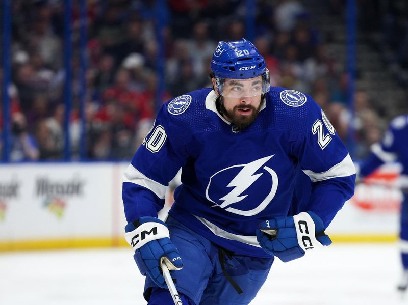 Feb 22, 2024; Tampa, Florida, USA;  Tampa Bay Lightning left wing Nicholas Paul (20) controls the puck against the Washington Capitals in the third period at Amalie Arena. Mandatory Credit: Nathan Ray Seebeck-USA TODAY Sports