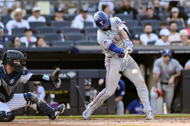 Aug 10, 2024; Bronx, New York, USA; Texas Rangers second baseman Marcus Semien (2) hits a single against the New York Yankees during the third inning at Yankee Stadium. Mandatory Credit: John Jones-USA TODAY Sports