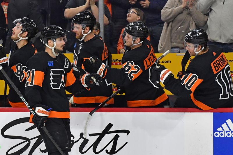 Mar 4, 2024; Philadelphia, Pennsylvania, USA; Philadelphia Flyers center Scott Laughton (21) celebrates his goal with right wing Olle Lycksell (62) and right wing Bobby Brink (10) against the St. Louis Blues during the first period at Wells Fargo Center. Mandatory Credit: Eric Hartline-USA TODAY Sports