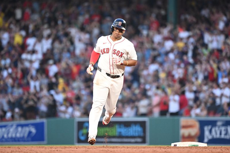 Jul 30, 2024; Boston, Massachusetts, USA; Boston Red Sox third baseman Rafael Devers (11) runs the bases after hitting a two-run home run against the Seattle Mariners during the third inning at Fenway Park. Mandatory Credit: Eric Canha-USA TODAY Sports