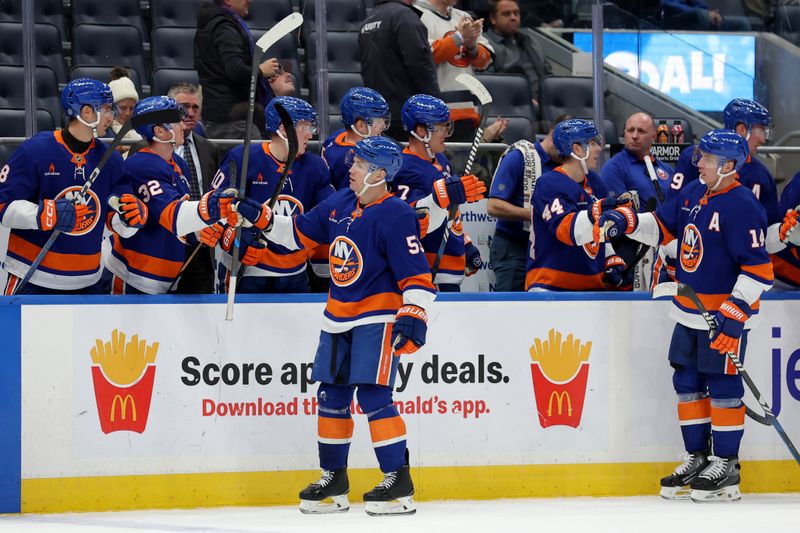 Dec 5, 2024; Elmont, New York, USA; New York Islanders center Casey Cizikas (53) celebrates his goal against the Seattle Kraken with teammates during the third period at UBS Arena. Mandatory Credit: Brad Penner-Imagn Images