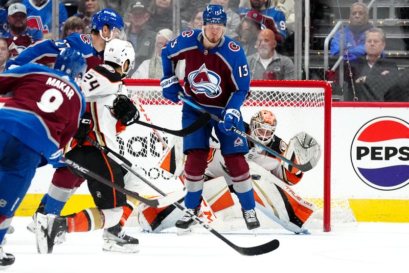 Nov 15, 2023; Denver, Colorado, USA; Colorado Avalanche right wing Valeri Nichushkin (13) shields Anaheim Ducks goaltender Lukas Dostal (1) as defenseman Cale Makar (8) shoots the puck in the third period at Ball Arena. Mandatory Credit: Ron Chenoy-USA TODAY Sports