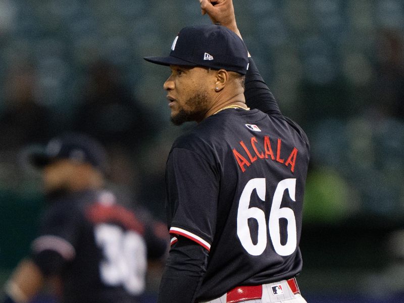 Jun 21, 2024; Oakland, California, USA; Minnesota Twins pitcher Jorge Alcala (66) reacts against the Oakland Athletics during the seventh inning at Oakland-Alameda County Coliseum. Mandatory Credit: Stan Szeto-USA TODAY Sports