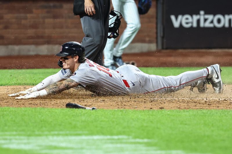 Sep 3, 2024; New York City, New York, USA;  Boston Red Sox center fielder Jarren Duran (16) slides safely into home plate in the eighth inning against the New York Mets at Citi Field. Mandatory Credit: Wendell Cruz-Imagn Images