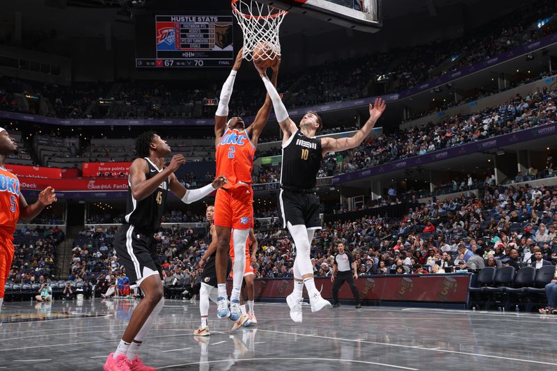 MEMPHIS, TN - MARCH 16: Luke Kennard #10 of the Memphis Grizzlies rebounds the ball during the game against the Oklahoma City Thunder on March 16, 2024 at FedExForum in Memphis, Tennessee. NOTE TO USER: User expressly acknowledges and agrees that, by downloading and or using this photograph, User is consenting to the terms and conditions of the Getty Images License Agreement. Mandatory Copyright Notice: Copyright 2024 NBAE (Photo by Joe Murphy/NBAE via Getty Images)