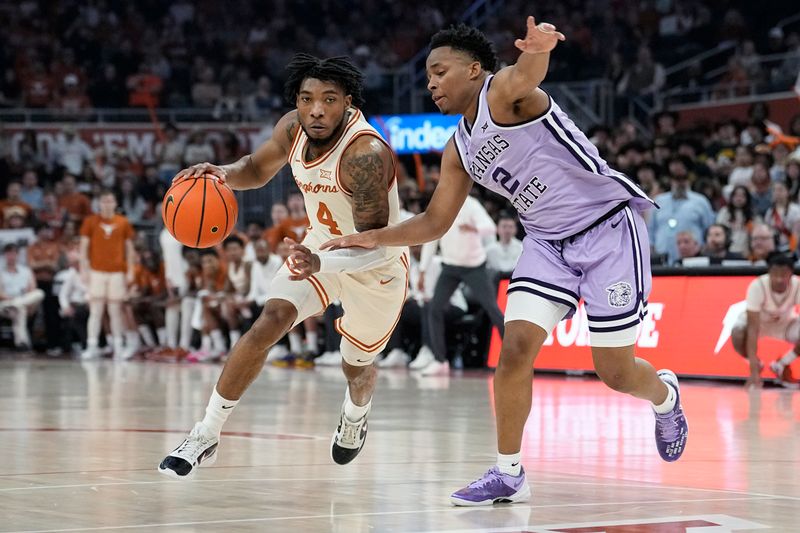 Feb 19, 2024; Austin, Texas, USA; Texas Longhorns guard Tyrese Hunter (4) moves to the basket while defended by Kansas State Wildcats guard Tylor Perry (2) during the first half at Moody Center. Mandatory Credit: Scott Wachter-USA TODAY Sports