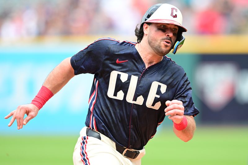 May 22, 2024; Cleveland, Ohio, USA; Cleveland Guardians catcher Austin Hedges (27) advances to third on a hit by Cleveland Guardians center fielder Tyler Freeman (not pictured) during the sixth inning against the New York Mets at Progressive Field. Mandatory Credit: Ken Blaze-USA TODAY Sports
