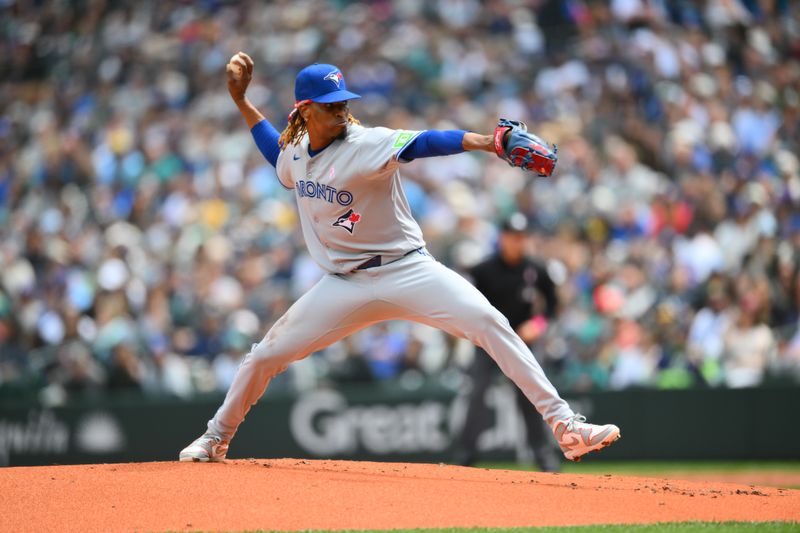 May 11, 2025; Seattle, Washington, USA; Toronto Blue Jays starting pitcher Jose Urena (48) pitches to the Seattle Mariners during the first inning at T-Mobile Park. Mandatory Credit: Steven Bisig-Imagn Images