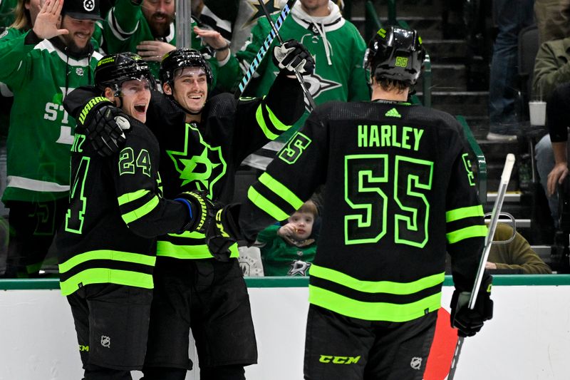 Jan 10, 2024; Dallas, Texas, USA; Dallas Stars center Roope Hintz (24) and left wing Mason Marchment (27) and defenseman Thomas Harley (55) celebrates a goal scored by Hintz against the Minnesota Wild during the second period at the American Airlines Center. Mandatory Credit: Jerome Miron-USA TODAY Sports