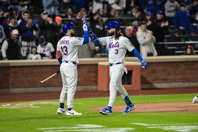 Apr 21, 2025; New York City, New York, USA; New York Mets outfielder Jesse Winker (3) is greeted at home plate by catcher Luis Torrens (13) after hitting a solo home run against the Philadelphia Phillies during the second inning at Citi Field. Mandatory Credit: John Jones-Imagn Images