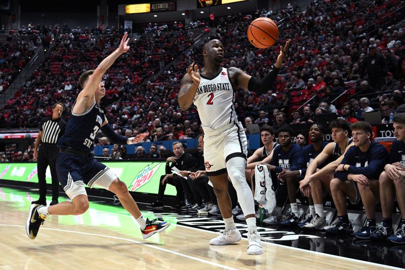 Jan 25, 2023; San Diego, California, USA; San Diego State Aztecs guard Adam Seiko (2) looses control of the ball while defended by Utah State Aggies guard Steven Ashworth (3) during the first half at Viejas Arena. Mandatory Credit: Orlando Ramirez-USA TODAY Sports