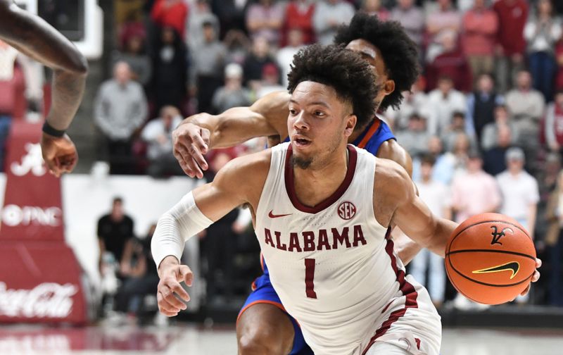 Feb 21, 2024; Tuscaloosa, Alabama, USA;  Alabama Crimson Tide guard Mark Sears (1) drives against Florida Gators forward Zyon Pullin (0) at Coleman Coliseum. Mandatory Credit: Gary Cosby Jr.-USA TODAY Sports