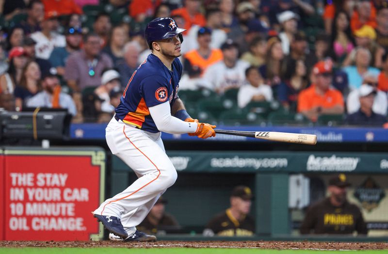 Sep 10, 2023; Houston, Texas, USA; Houston Astros catcher Yainer Diaz (21) hits a single during the sixth inning against the San Diego Padres at Minute Maid Park. Mandatory Credit: Troy Taormina-USA TODAY Sports