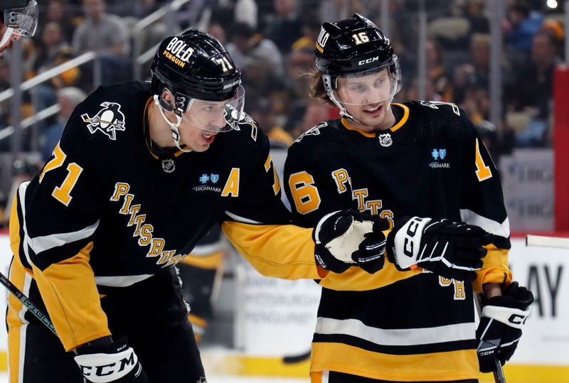 Feb 22, 2024; Pittsburgh, Pennsylvania, USA; Pittsburgh Penguins center Evgeni Malkin (71) makes a point to right wing Matthew Phillips (16) against the Montreal Canadiens during the first period at PPG Paints Arena. Mandatory Credit: Charles LeClaire-USA TODAY Sports