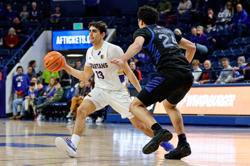 Jan 13, 2024; Colorado Springs, Colorado, USA; San Jose State Spartans guard Alvaro Cardenas (13) passes the ball as Air Force Falcons guard Jeffrey Mills (24) guards in the first half at Clune Arena. Mandatory Credit: Isaiah J. Downing-USA TODAY Sports