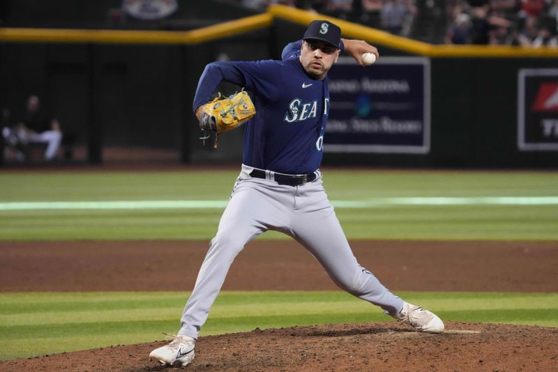 Jul 30, 2023; Phoenix, Arizona, USA; Seattle Mariners relief pitcher Tayler Saucedo (60) pitches against the Arizona Diamondbacks during the ninth inning at Chase Field. Mandatory Credit: Joe Camporeale-USA TODAY Sports