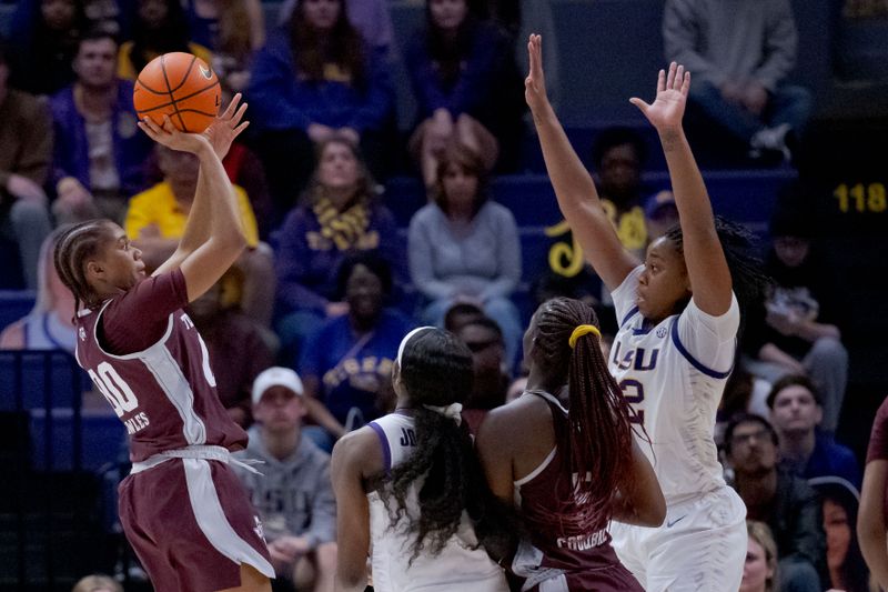 Jan 11, 2024; Baton Rouge, Louisiana, USA; Texas A&M Aggies guard Sydney Bowles (00) shoots against LSU Lady Tigers guard Mikaylah Williams (12) during the second half at Pete Maravich Assembly Center. Mandatory Credit: Matthew Hinton-USA TODAY Sports