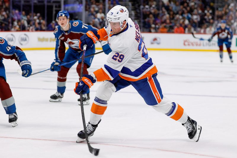 Oct 14, 2024; Denver, Colorado, USA; New York Islanders center Brock Nelson (29) takes a shot in the first period against the Colorado Avalanche at Ball Arena. Mandatory Credit: Isaiah J. Downing-Imagn Images