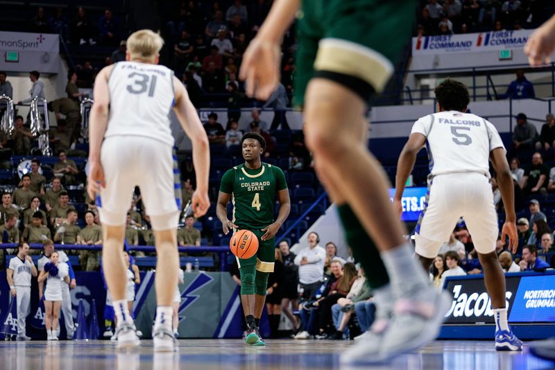 Mar 9, 2024; Colorado Springs, Colorado, USA; Colorado State Rams guard Isaiah Stevens (4) dribbles the ball up court as Air Force Falcons forward Rytis Petraitis (31) and guard Ethan Taylor (5) guard in the first half at Clune Arena. Mandatory Credit: Isaiah J. Downing-USA TODAY Sports