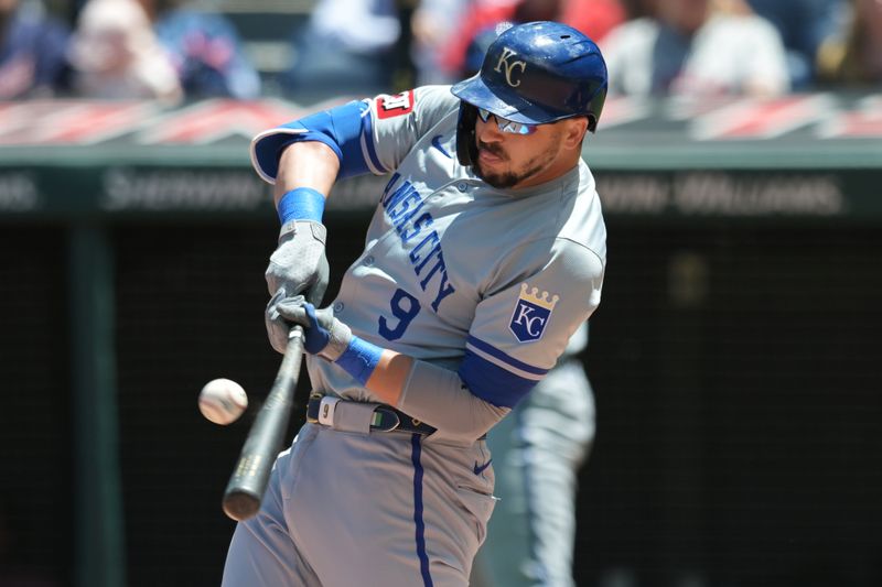 Jun 6, 2024; Cleveland, Ohio, USA; Kansas City Royals first baseman Vinnie Pasquantino (9) hits an RBI double during the first inning against the Cleveland Guardians at Progressive Field. Mandatory Credit: Ken Blaze-USA TODAY Sports