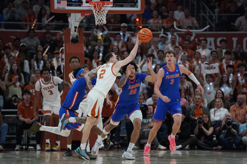 Feb 25, 2026; Austin, Texas, USA; Texas Longhorns guard Chendall Weaver (2) grabs the ball during the second half against the Florida Gators at Moody Center. Mandatory Credit: Dustin Safranek-Imagn Images