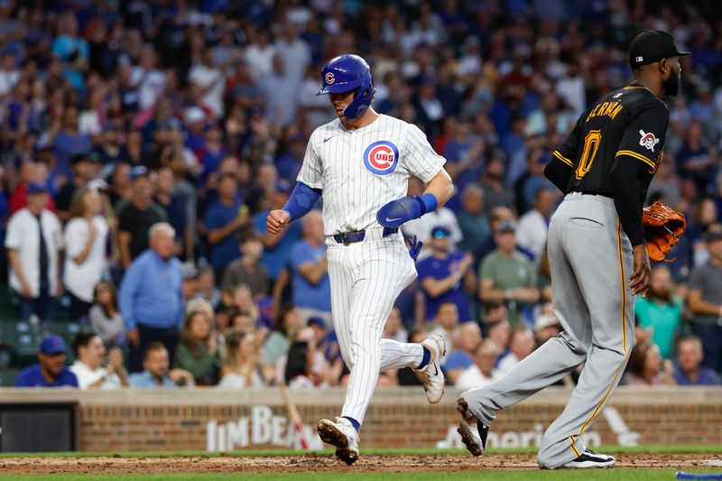 Sep 4, 2024; Chicago, Illinois, USA; Chicago Cubs second baseman Nico Hoerner (2) scores against the Pittsburgh Pirates during the second inning at Wrigley Field. Mandatory Credit: Kamil Krzaczynski-Imagn Images