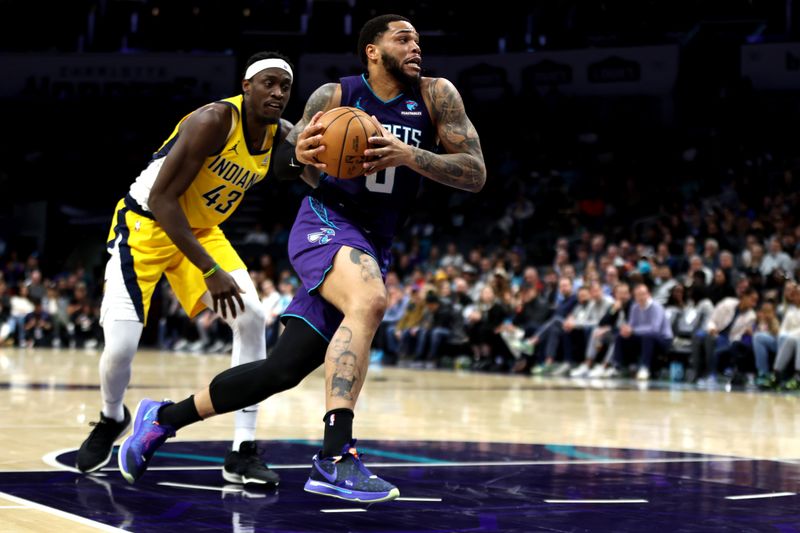 CHARLOTTE, NORTH CAROLINA - FEBRUARY 12: Miles Bridges #0 of the Charlotte Hornets drives to the basket during the first half of an NBA game against the Indiana Pacers at Spectrum Center on February 12, 2024 in Charlotte, North Carolina. NOTE TO USER: User expressly acknowledges and agrees that, by downloading and or using this photograph, User is consenting to the terms and conditions of the Getty Images License Agreement. (Photo by David Jensen/Getty Images)