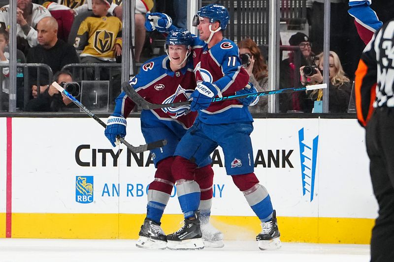 Oct 31, 2025; Las Vegas, Nevada, USA; Colorado Avalanche center Brock Nelson (11) celebrates with defenseman Josh Manson (42) after scoring a goal against the Vegas Golden Knights during the second period at T-Mobile Arena. Mandatory Credit: Stephen R. Sylvanie-Imagn Images