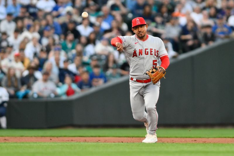 Sep 11, 2023; Seattle, Washington, USA; Los Angeles Angels third baseman Eduardo Escobar (5) throws to first base for the force out on Seattle Mariners first baseman Ty France (not pictured) during the first inning at T-Mobile Park. Mandatory Credit: Steven Bisig-USA TODAY Sports