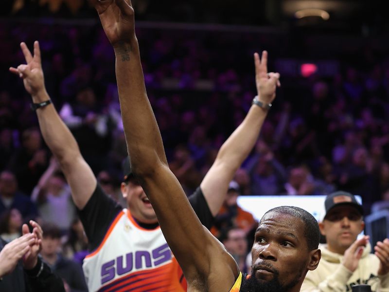 PHOENIX, ARIZONA - FEBRUARY 11: Kevin Durant #35 of the Phoenix Suns acknowledges the fans after scoring his 30,000th career point during the second half of the NBA game against the Memphis Grizzlies at Footprint Center on February 11, 2025 in Phoenix, Arizona.  NOTE TO USER: User expressly acknowledges and agrees that, by downloading and or using this photograph, User is consenting to the terms and conditions of the Getty Images License Agreement.  (Photo by Christian Petersen/Getty Images)