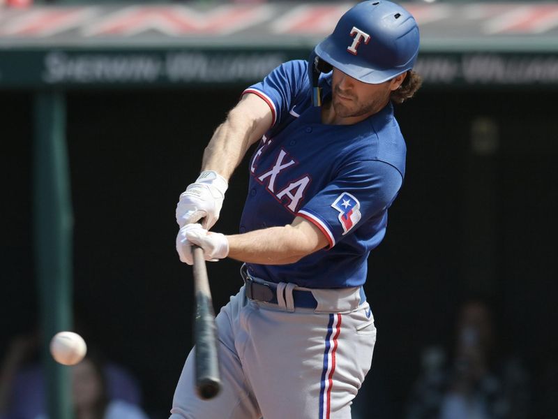 Sep 17, 2023; Cleveland, Ohio, USA; Texas Rangers third baseman Josh Smith (47) hits an RBI double during the second inning against the Cleveland Guardians at Progressive Field. Mandatory Credit: Ken Blaze-USA TODAY Sports