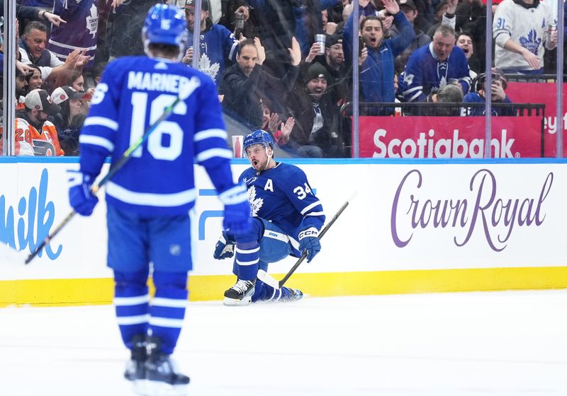 Feb 15, 2024; Toronto, Ontario, CAN; Toronto Maple Leafs center Auston Matthews (34) celebrates after scoring his first goal against the Philadelphia Flyers during the second period at Scotiabank Arena. Mandatory Credit: Nick Turchiaro-USA TODAY Sports