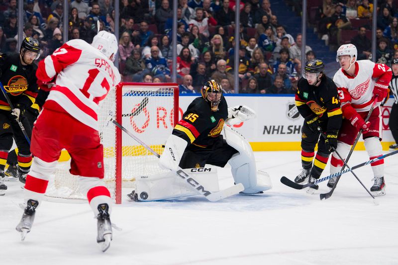 Feb 15, 2024; Vancouver, British Columbia, CAN; Vancouver Canucks goalie Thatcher Demko (35) makes a save on Detroit Red Wings forward Daniel Sprong (17)  in the second period at Rogers Arena. Mandatory Credit: Bob Frid-USA TODAY Sports