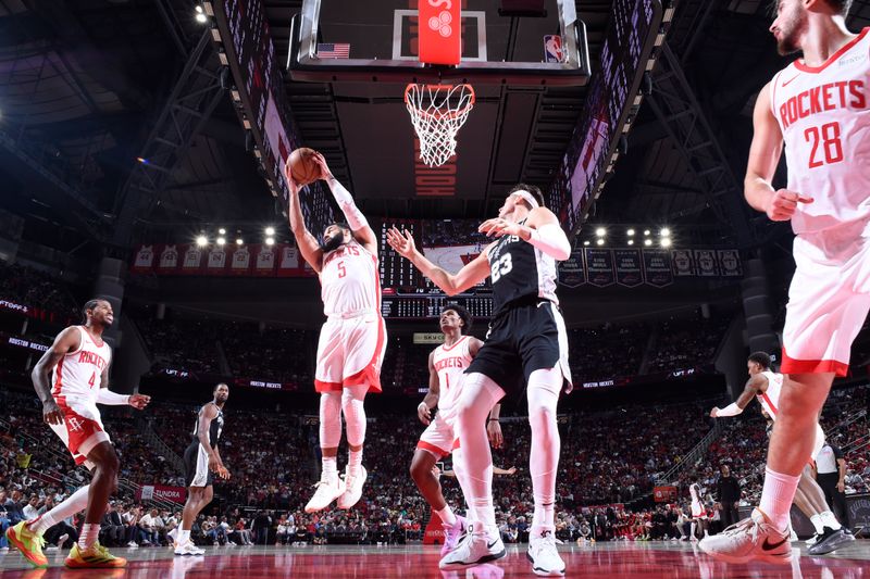 HOUSTON, TX - NOVEMBER 6:  Fred VanVleet #5 of the Houston Rockets goes up for the rebound during the game against the San Antonio Spurs on November 6, 2024 at the Toyota Center in Houston, Texas. NOTE TO USER: User expressly acknowledges and agrees that, by downloading and or using this photograph, User is consenting to the terms and conditions of the Getty Images License Agreement. Mandatory Copyright Notice: Copyright 2024 NBAE (Photo by Logan Riely/NBAE via Getty Images)