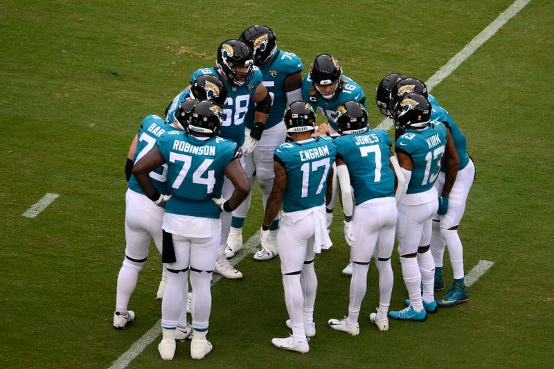 The Jacksonville Jaguars huddle during the first half of a NFL football game against the Washington Commanders, Sunday, Sept. 11, 2022, in Landover, Md. (AP Photo/Nick Wass)