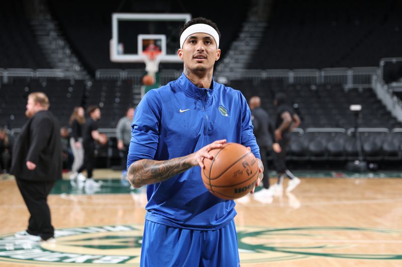 MILWAUKEE, WI - MARCH 13: Kyle Kuzma #18 of the Milwaukee Bucks shoots the ball before the game against the Los Angeles Lakers on March 13, 2025 at Fiserv Forum Center in Milwaukee, Wisconsin. NOTE TO USER: User expressly acknowledges and agrees that, by downloading and or using this Photograph, user is consenting to the terms and conditions of the Getty Images License Agreement. Mandatory Copyright Notice: Copyright 2025 NBAE (Photo by Jeff Haynes/NBAE via Getty Images).