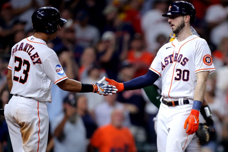 Sep 13, 2023; Houston, Texas, USA; Houston Astros right fielder Kyle Tucker (30) is congratulated by Houston Astros designated hitter Michael Brantley (23) after hitting a home run against the Oakland Athletics during the seventh inning at Minute Maid Park. Mandatory Credit: Erik Williams-USA TODAY Sports