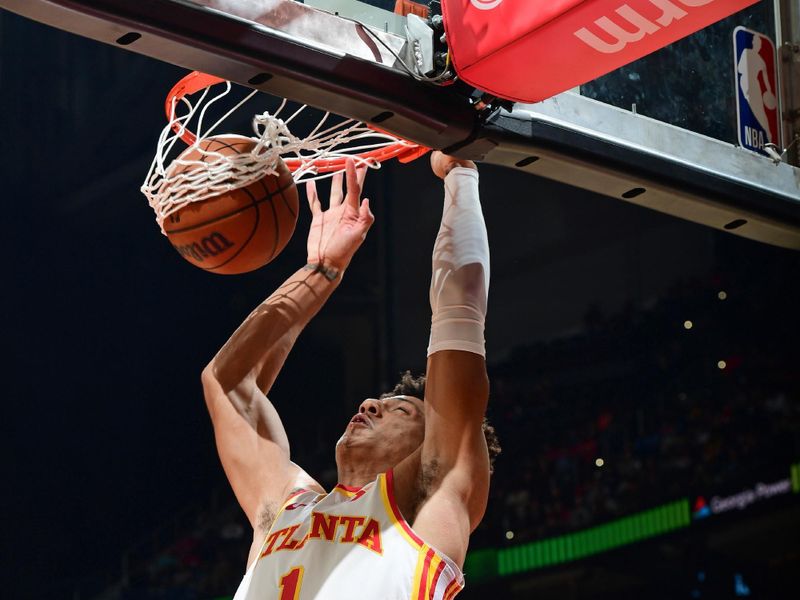 ATLANTA, GA - APRIL 3:Jalen Johnson #1 of the Atlanta Hawks dunks the ball during the game against the Detroit Pistons  on April 3, 2024 at State Farm Arena in Atlanta, Georgia.  NOTE TO USER: User expressly acknowledges and agrees that, by downloading and/or using this Photograph, user is consenting to the terms and conditions of the Getty Images License Agreement. Mandatory Copyright Notice: Copyright 2024 NBAE (Photo by Scott Cunningham/NBAE via Getty Images)