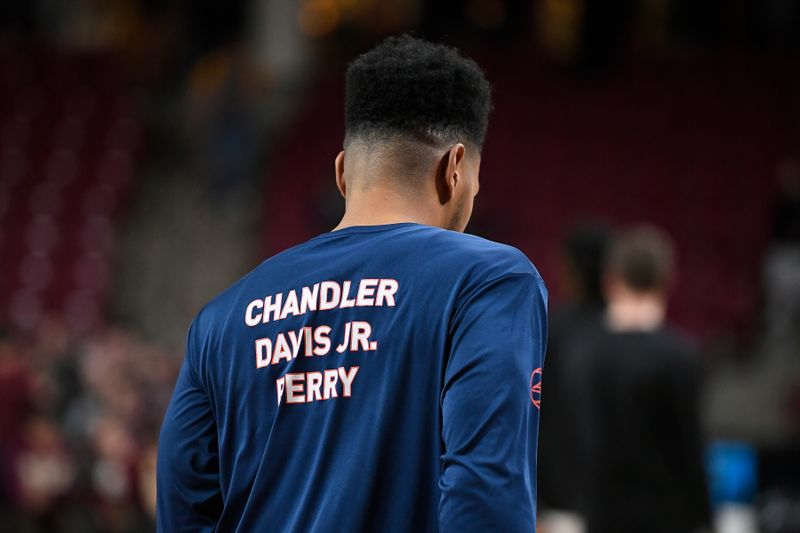 Feb 22, 2023; Chestnut Hill, Massachusetts, USA; A member of the Virginia Cavaliers men's basketball team wears a warmup jersey honoring fallen Virginia football classmates at Conte Forum. Mandatory Credit: Eric Canha-USA TODAY Sports