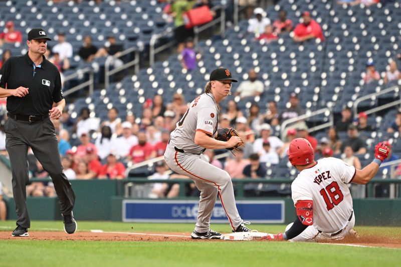 Aug 6, 2024; Washington, District of Columbia, USA; Washington Nationals first baseman Juan Yepez (18) slides into first base in front of San Francisco Giants starting pitcher Hayden Birdsong (60) during the first inning at Nationals Park. Mandatory Credit: Rafael Suanes-USA TODAY Sports