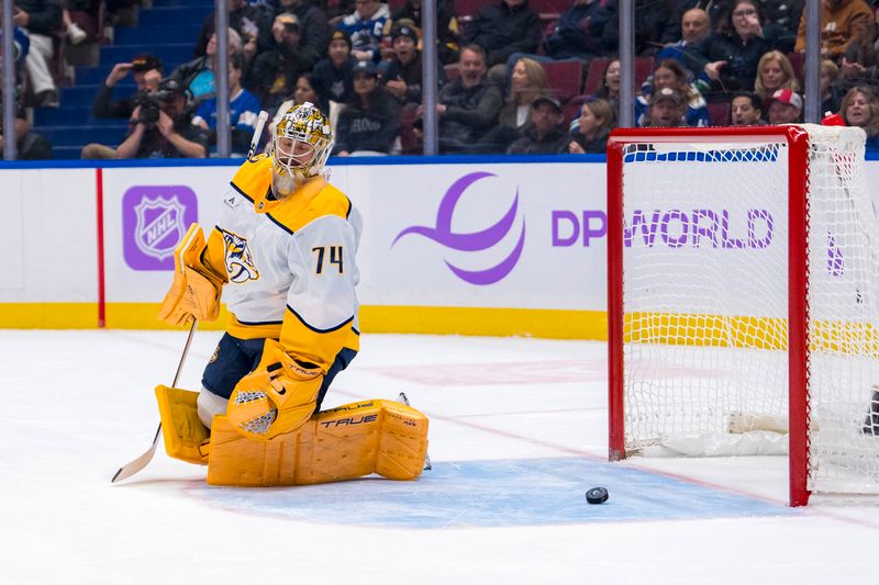 Nov 17, 2024; Vancouver, British Columbia, CAN; Nashville Predators goalie Juuse Saros (74) reacts to a goal scored by Vancouver Canucks defenseman Erik Brannstrom (26) during the first period at Rogers Arena. Mandatory Credit: Bob Frid-Imagn Images