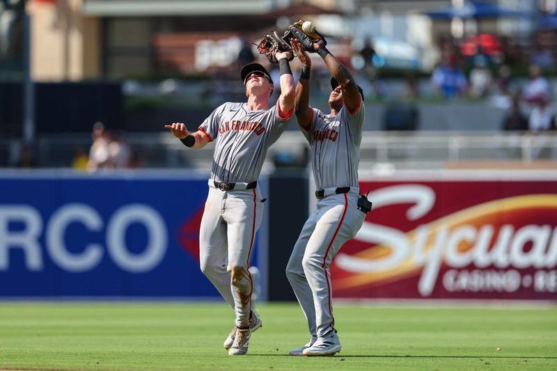 Sep 8, 2024; San Diego, California, USA; San Francisco Giants shortstop Tyler Fitzgerald (49), left, and second baseman Marco Luciano (37) collide while trying to catch a fly ball from San Diego Padres left fielder Jurickson Profar (not pictured) during the seventh inning at Petco Park. Mandatory Credit: Chadd Cady-Imagn Images