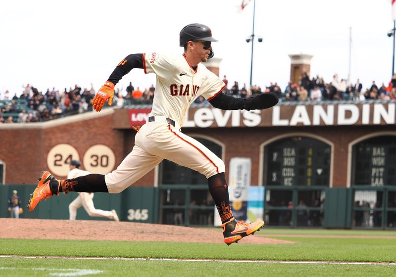 Apr 24, 2025; San Francisco, California, USA; San Francisco Giants pinch runner Christian Koss (50) scores a run against the Milwaukee Brewers during the eighth inning at Oracle Park. Mandatory Credit: Kelley L Cox-Imagn Images