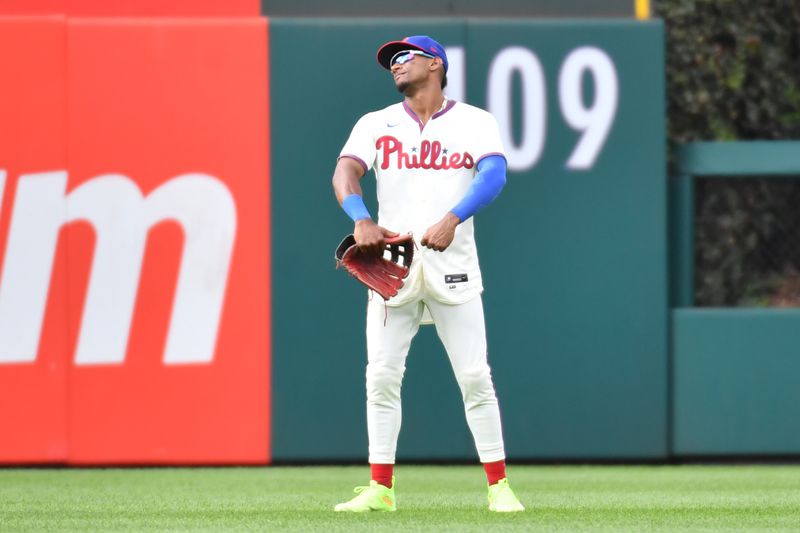 Aug 27, 2023; Philadelphia, Pennsylvania, USA; Philadelphia Phillies center fielder Johan Rojas (18) celebrates win in the outfield against the St. Louis Cardinals at Citizens Bank Park. Mandatory Credit: Eric Hartline-USA TODAY Sports