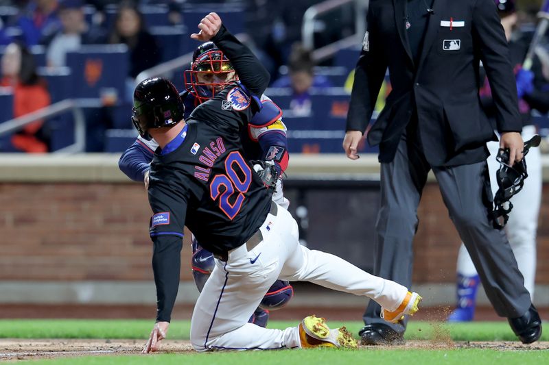 May 10, 2024; New York City, New York, USA; Atlanta Braves catcher Travis d'Arnaud (16) tags out New York Mets first baseman Pete Alonso (20) trying to score on a fielder's choice by Mets center fielder Harrison Bader (not pictured) during the second inning at Citi Field. Mandatory Credit: Brad Penner-USA TODAY Sports