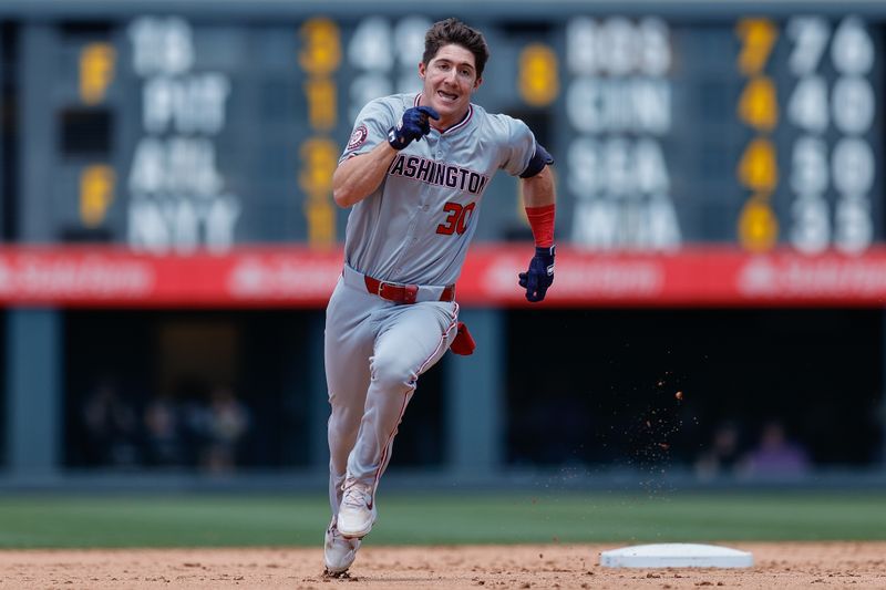 Jun 23, 2024; Denver, Colorado, USA; Washington Nationals center fielder Jacob Young (30) runs to third on a single from a throwing error in the sixth inning against the Colorado Rockies at Coors Field. Mandatory Credit: Isaiah J. Downing-USA TODAY Sports