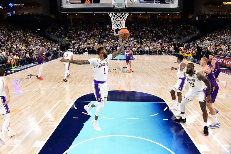 LOS ANGELES, CA - OCTOBER 6: D'Angelo Russell #1 of the Los Angeles Lakers goes up for the rebound during the game against the Phoenix Suns on October 6, 2024 at Acrisure Arena in Palm Springs, California. NOTE TO USER: User expressly acknowledges and agrees that, by downloading and/or using this Photograph, user is consenting to the terms and conditions of the Getty Images License Agreement. Mandatory Copyright Notice: Copyright 2024 NBAE (Photo by Adam Pantozzi/NBAE via Getty Images)